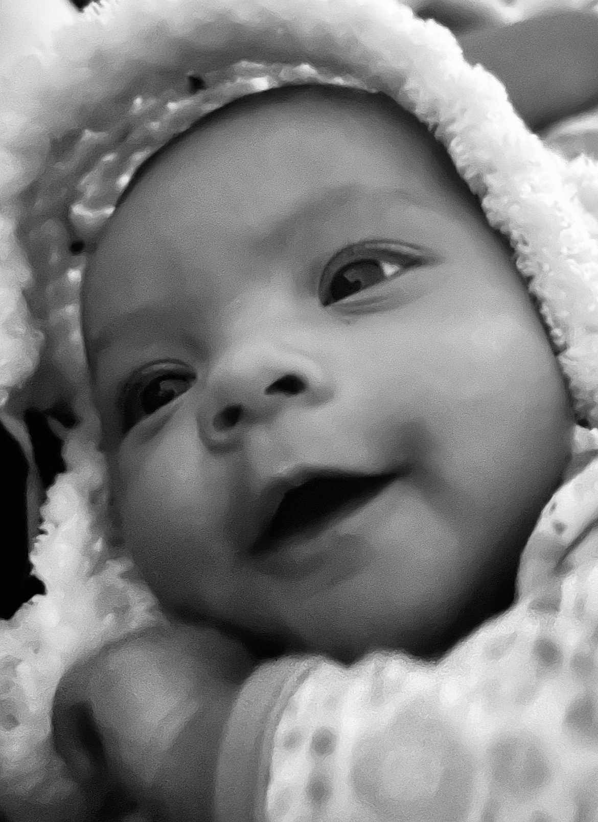 Xaviera joined the competition — help win amazing prizes! baby, close_up, black_and_white, smiling, face, infant, blanket, hood, cute, portrait, soft_texture, warm, newborn, cozy, expression, eyes, cheeks, child, wrapped, peaceful