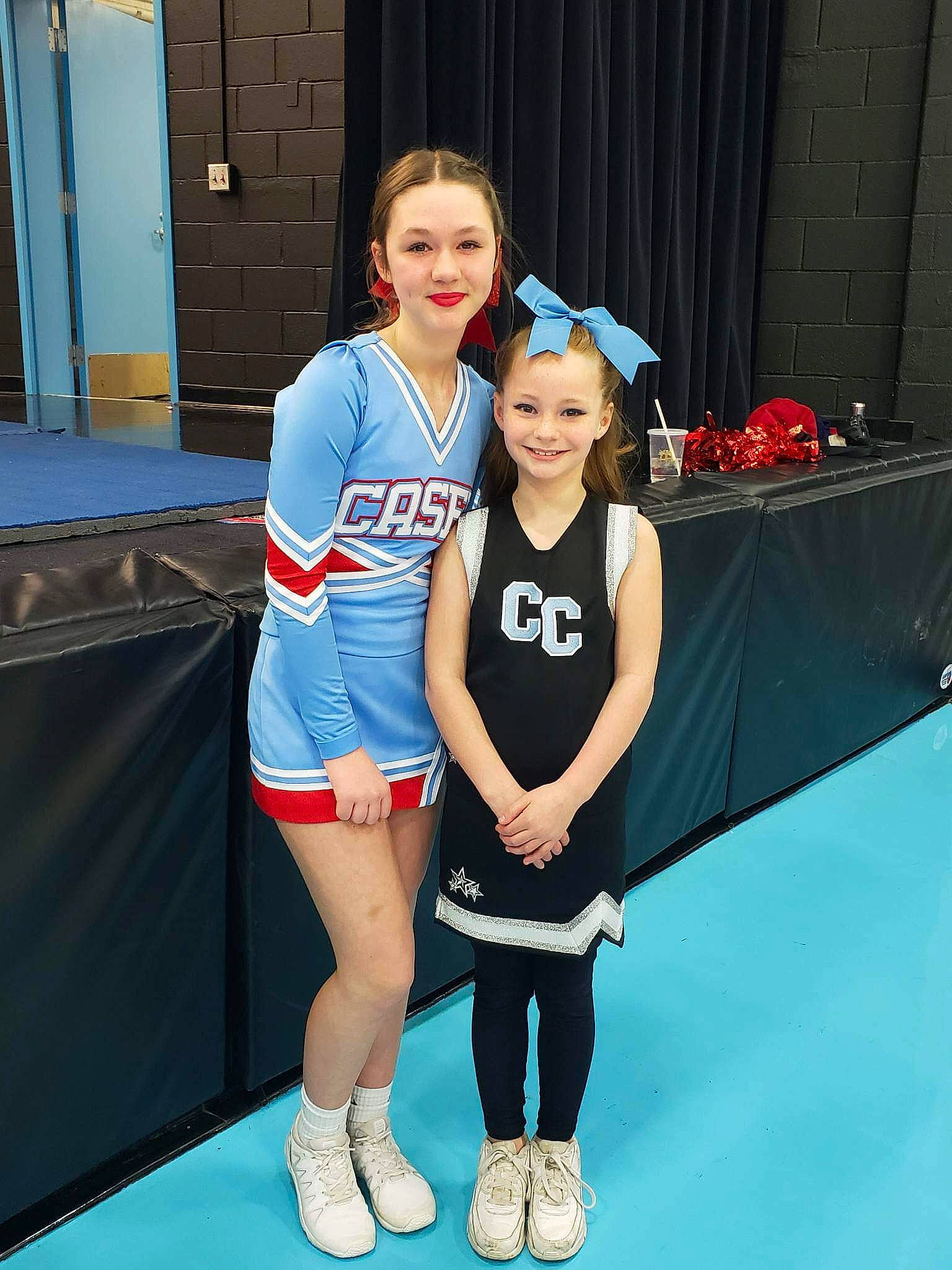 Emily Myjesta joined the competition — help win amazing prizes! arm, ball_game, blue, championship, cheerleading_uniform, door, electric_blue, human_leg, joint, joy, knee, leg, person, player, shoe, smile, sneakers, sports, sports_uniform, sportswear