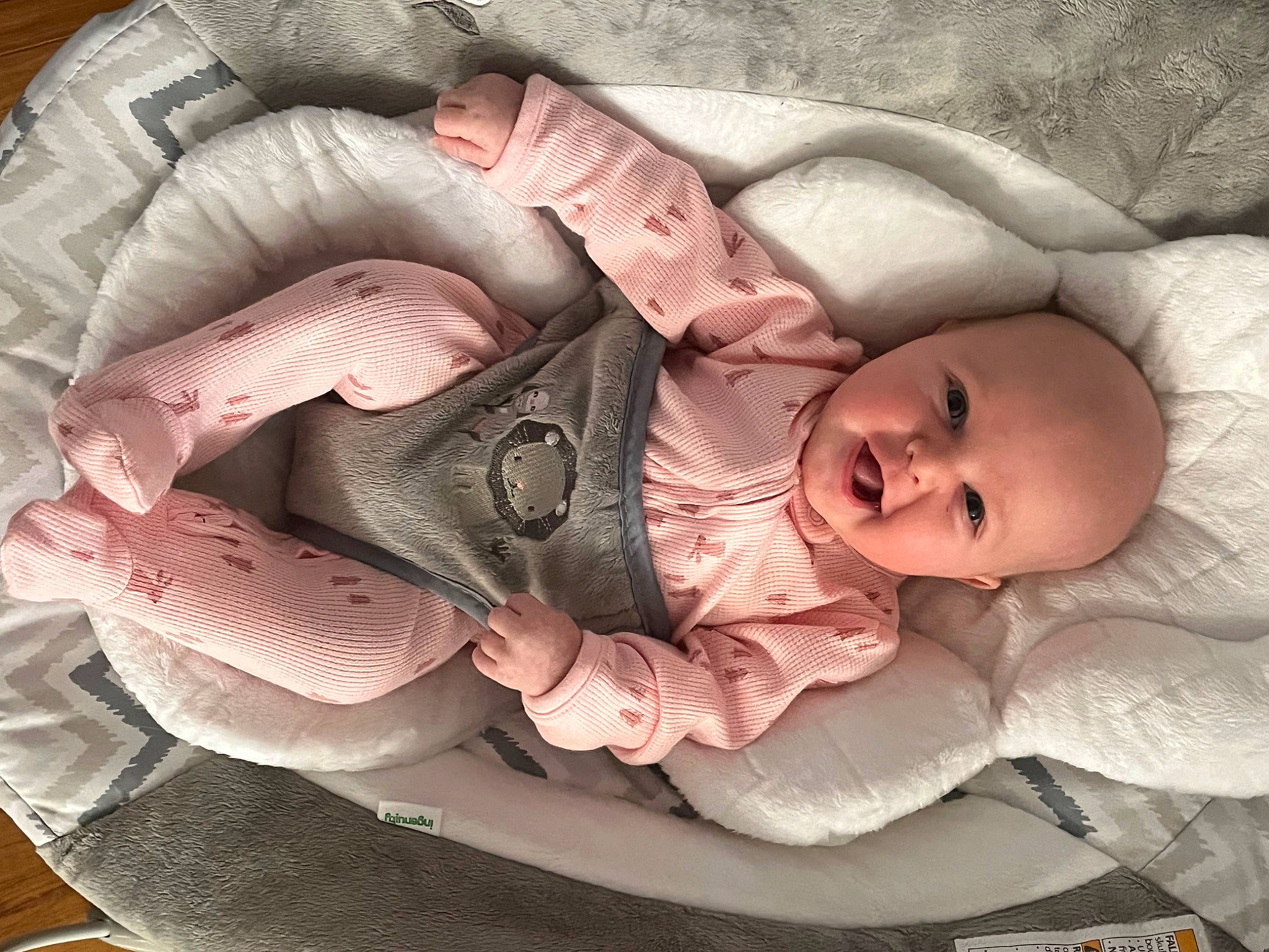 Lyla is registered to the contest to win money with this photo: baby, baby_carriage, cheek, comfort, ear, eye, finger, hand, head, headgear, human_body, lip, mouth, nose, person, pink, skin, sleeve, textile, toddler