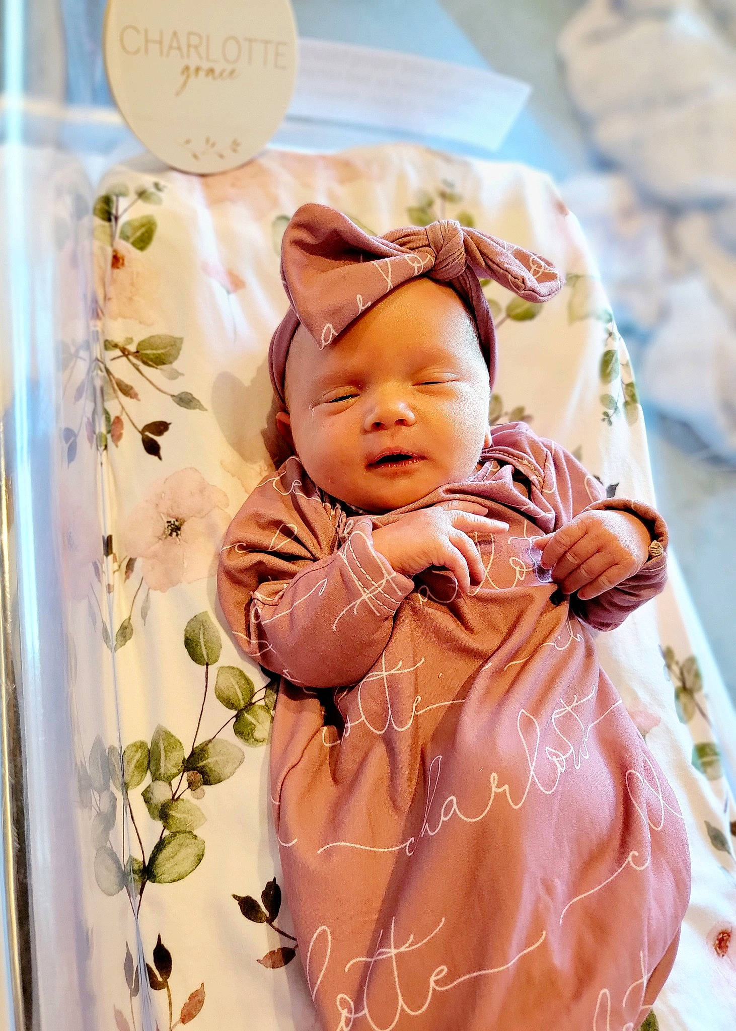 Charlotte joined the competition — help win amazing prizes! baby, baby_products, baby_toddler_clothing, child, doll, event, fashion_accessory, happy, linens, pattern, peach, person, pink, room, sitting, skin, sleeve, stuffed_toy, sweetness, toddler