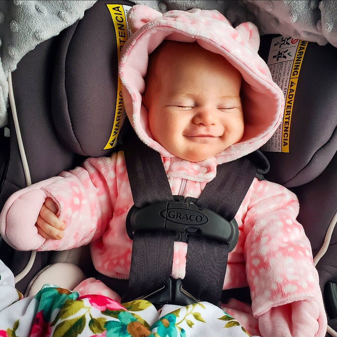 Kaelyn joined the competition — help win amazing prizes! baby, baby_in_car_seat, baby_products, baby_safety, baby_toddler_clothing, bonnet, cheek, child, comfort, headwear, mouth, person, pink, toddler