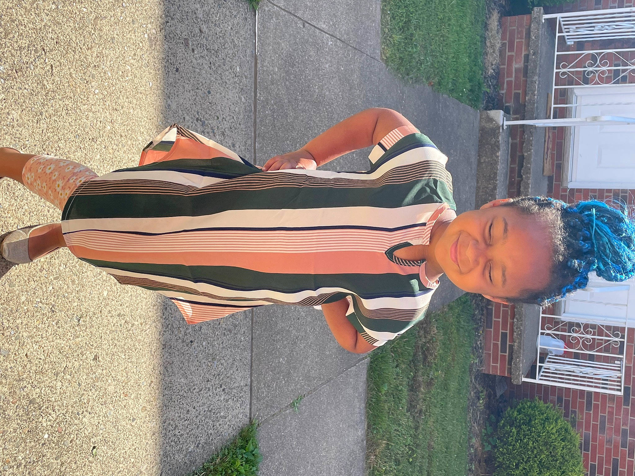 Akilah is registered to the contest to win money with this photo: art, comfort, fashion_accessory, grass, human_leg, joy, leisure, orange, person, shadow, sidewalk, street_fashion, tints_and_shades, waist, wood