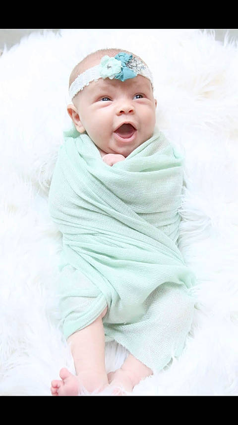 Nalani is registered to the contest to win money with this photo: baby, baby_toddler_clothing, barefoot, bonnet, cheek, child, flesh, foot, hair_accessory, headband, headpiece, nose, person, photography, portrait_photography, skin, toddler, toe