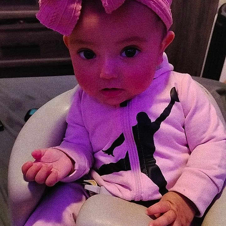 Anisa is registered to the contest to win money with this photo: baby, cap, chair, clothing, coat, computerhardware, costume, couch, electronics, face, furniture, hardware, hat, head, jacket, monitor, person, photography, portrait, purple