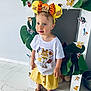 Mya a rejoint le concours — aidez-le/la à gagner de superbes lots ! child, toddler, girl, headband, yellow_skirt, white_tshirt, sandals, floor, indoor, decorations, jungle_theme, lion_king, cartoon_stickers, photo_frame, green_leaves, cute, standing, blue_eyes, light_skin, playful