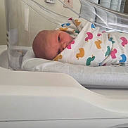 Matthew joined the competition — help win amazing prizes! baby, bassinet, bed, blanket, curtains, cute, duck_pattern, face, healthcare, hospital, infant, newborn, person, plastic, resting, sleeping, swaddled, tiny, white, wrapped