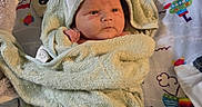 Matthew joined the competition — help win amazing prizes! baby, blanket, child, colorful, comfort, cute, expression, face, fist, hood, indoors, infant, lying_down, newborn, pattern, playmat, soft, towel, toy, wrapped