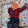 Matthew joined the competition — help win amazing prizes! baby, infant, clothing, red_shirt, denim_pants, white_socks, playpen, blanket, cartoon_pattern, raised_arm, lying_down, cute, child, indoor, soft_toys, plush, smiling, face, small_person, resting
