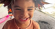 Seilose Brianna is registered to the contest to win money with this photo: child, smiling, leaf_crown, indoor, carpet, tshirt, scooter, happy, portrait, person, brown_leaves, playful, young_child, cute, casual_clothing, daylight, closeup, headwear, fun, natural