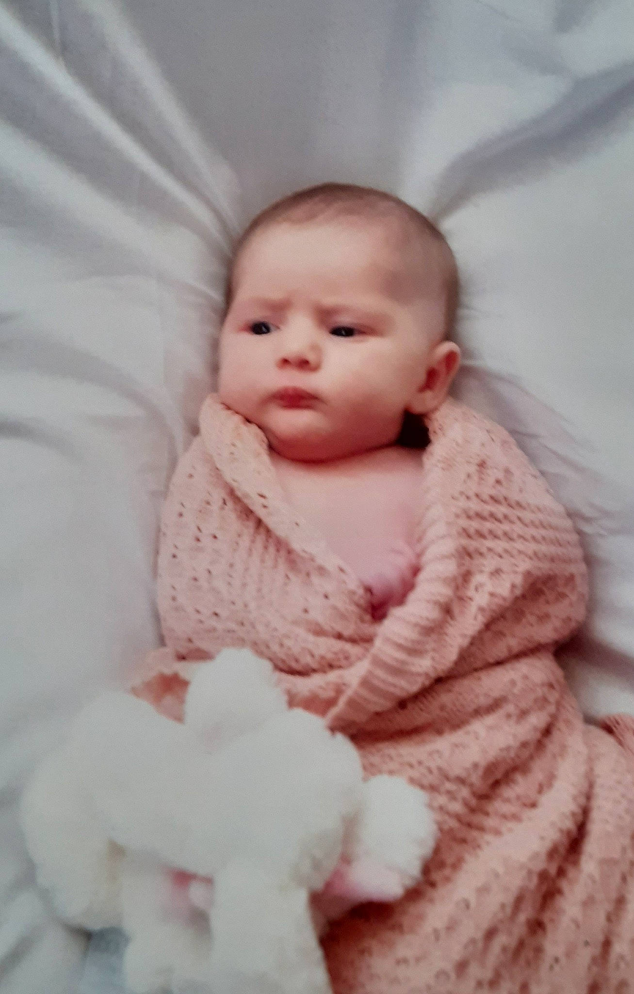 Sophia participe au concours pour gagner de l'argent avec cette photo : baby, baby_toddler_clothing, cheek, child, chin, comfort, fur, headgear, iris, linens, lip, magenta, neck, nose, person, pink, sitting, skin, sleeve, toddler