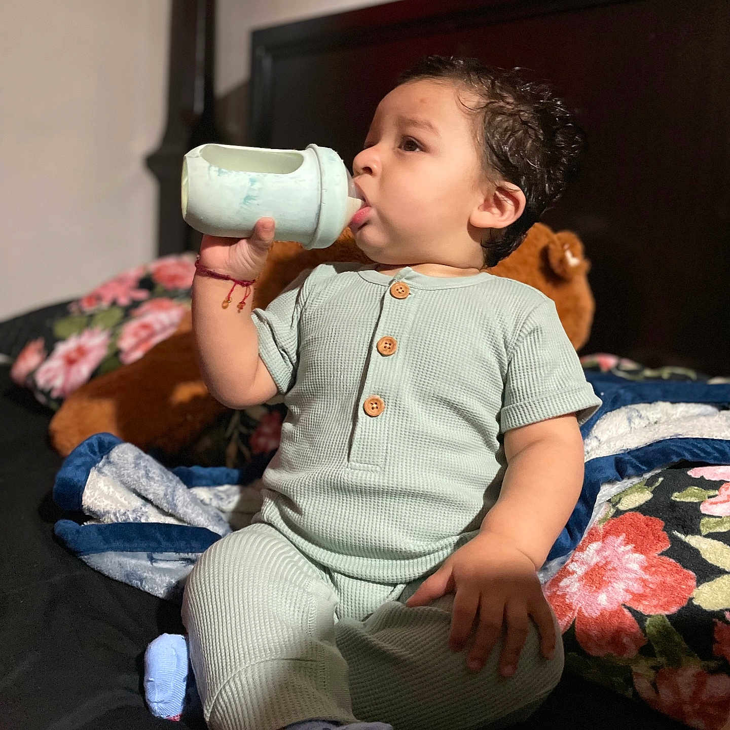 Jesús is registered to the contest to win money with this photo: baby, bed, bedroom, bodypart, bottle, clothing, couch, cushion, face, furniture, head, homedecor, indoors, pants, person, photography, portrait, room, shaker, sitting