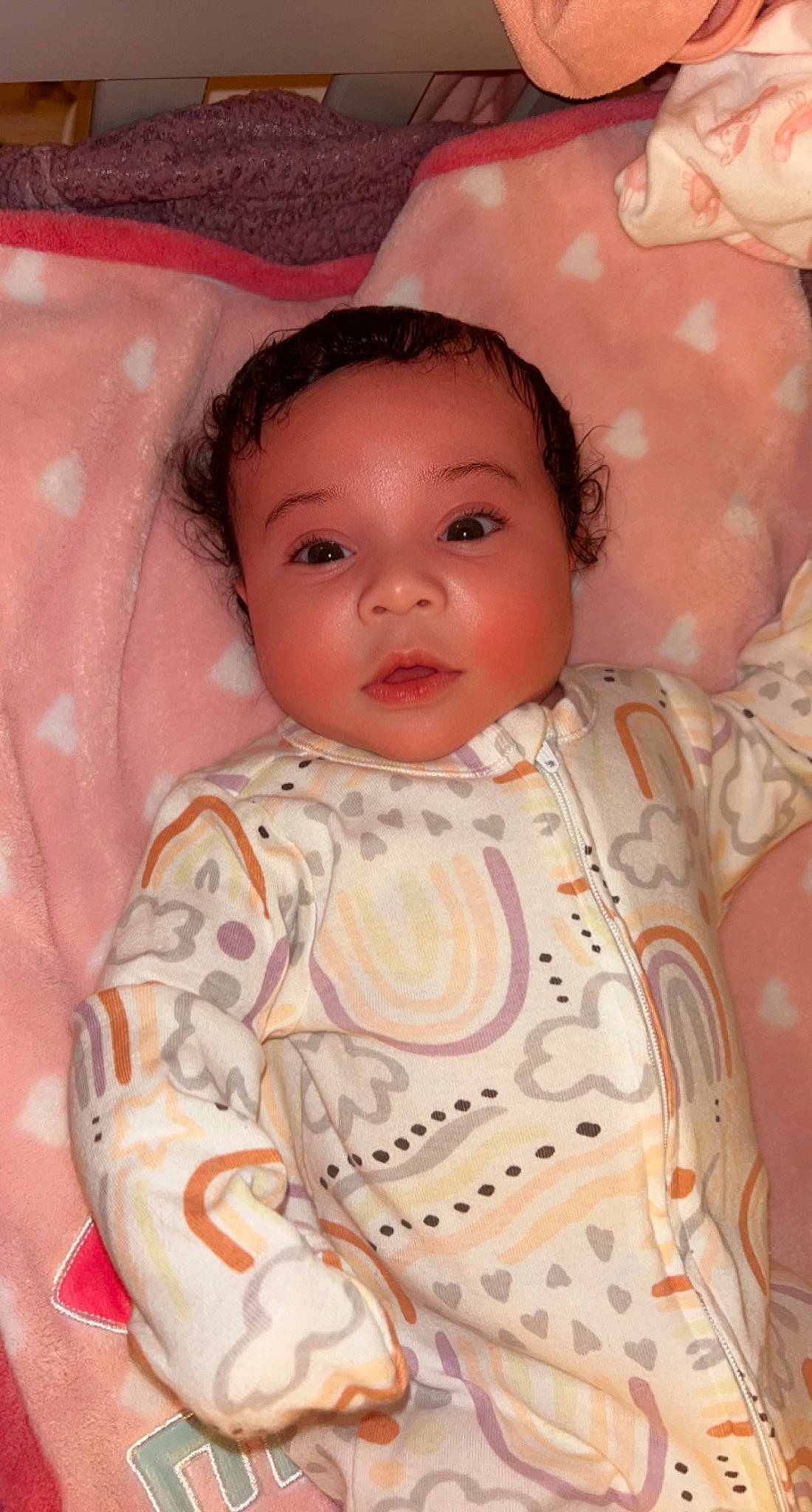 London is registered to the contest to win money with this photo: baby, baby_toddler_clothing, cheek, chin, dress, eyebrow, eyelash, forehead, human_body, iris, lip, mouth, neck, nose, person, pink, skin, sleeve, textile, toddler