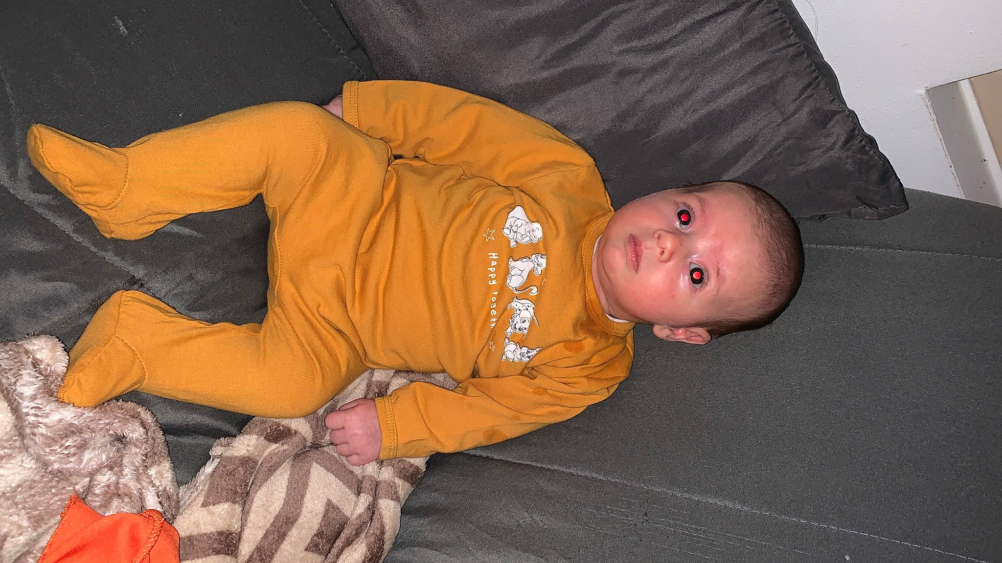 Harper participe au concours pour gagner de l'argent avec cette photo : baby, baby_toddler_clothing, carmine, child, comfort, elbow, flooring, fun, human_body, lap, orange, person, personal_protective_equipment, room, sitting, sleep, sleeve, thigh, toddler, wood