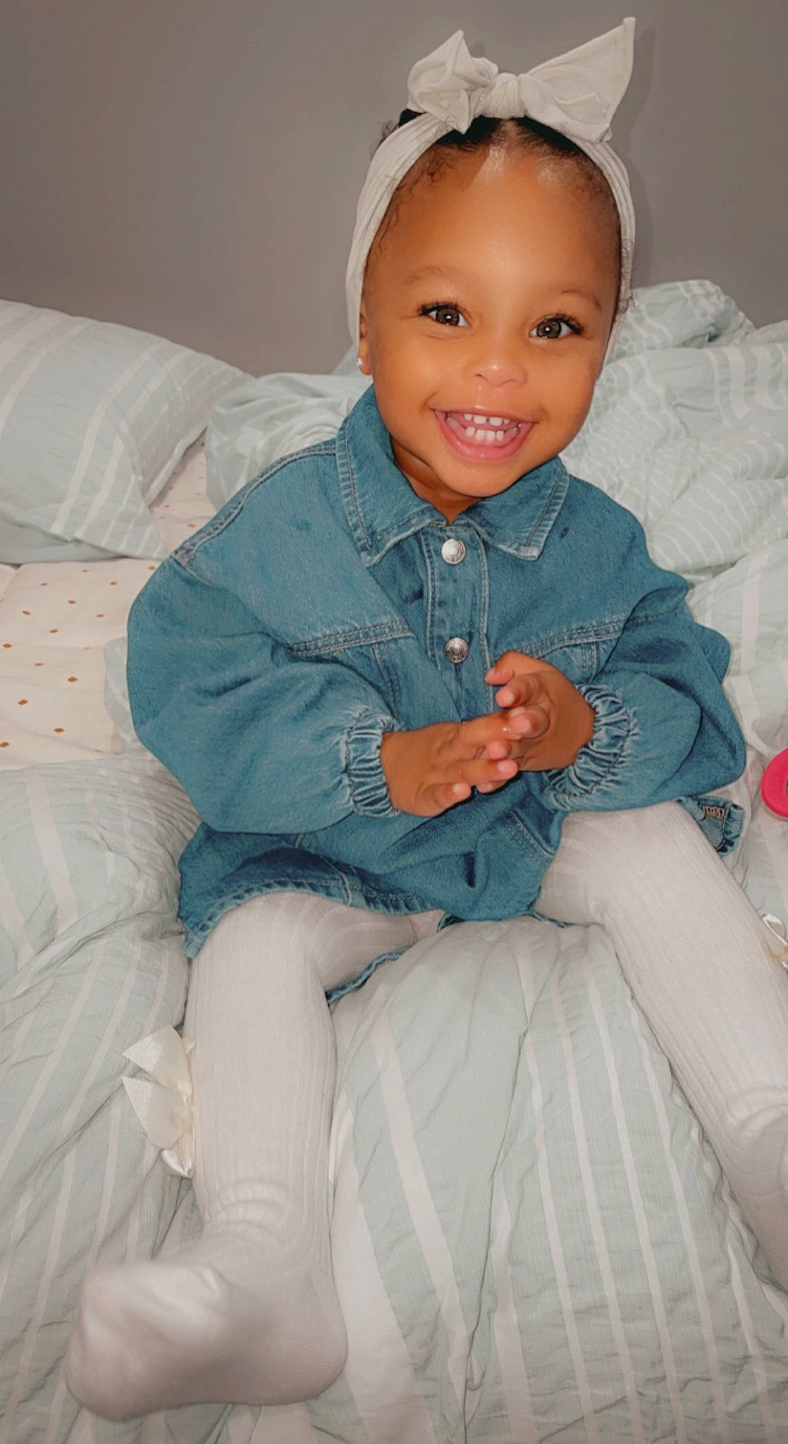 Saya is registered to the contest to win money with this photo: arm, baby_toddler_clothing, cheek, chin, clothing, comfort, eye, face, hair, hairstyle, hand, head, human_body, iris, joy, lip, person, pink, skin, sleeve