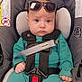 accessory, baby, baby_boy, baby_girl, car_seat, child, close_up, comfort, cute, headwear, indoors, infant, pacifier_clip, portrait, safety_harness, seat, seatbelt, serious_expression, sunglasses, teal_clothing