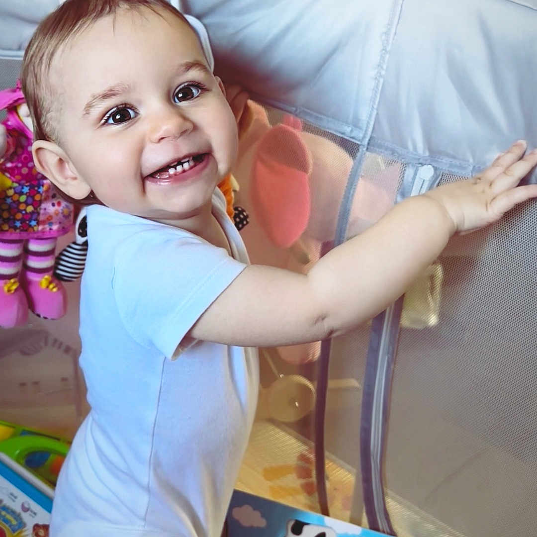 Darcie joined the competition — help win amazing prizes! animal, baby, bird, bodypart, clothing, couch, cushion, face, furniture, happy, head, homedecor, indoors, mouth, penguin, person, photography, portrait, smile, t_shirt