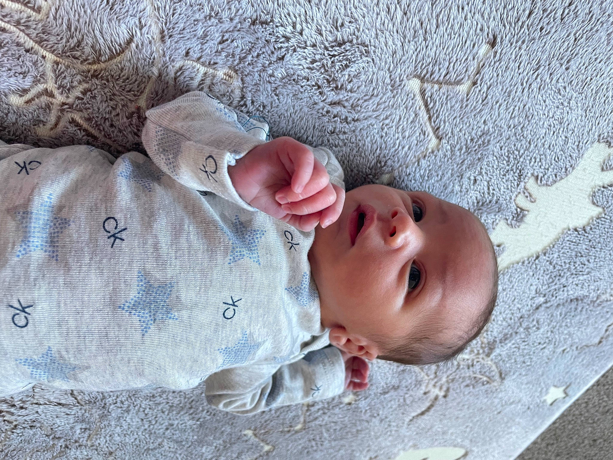 Roman is registered to the contest to win money with this photo: baby, baby_toddler_clothing, child, chin, concrete, grass, grey, hat, headgear, linens, lip, pattern, person, plant, portrait_photography, sand, skin, textile, toddler, tree