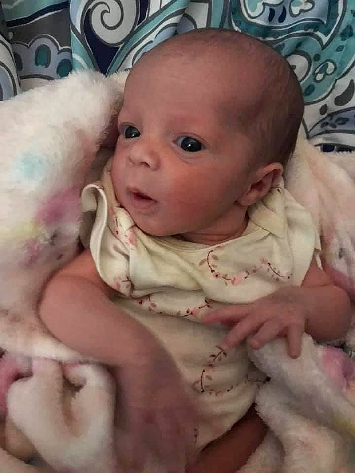 Jaycee is registered to the contest to win money with this photo: baby, baby_toddler_clothing, cheek, chin, comfort, dress, eye, eyebrow, eyelash, finger, happy, headgear, iris, linens, lip, mouth, nose, person, pink, skin