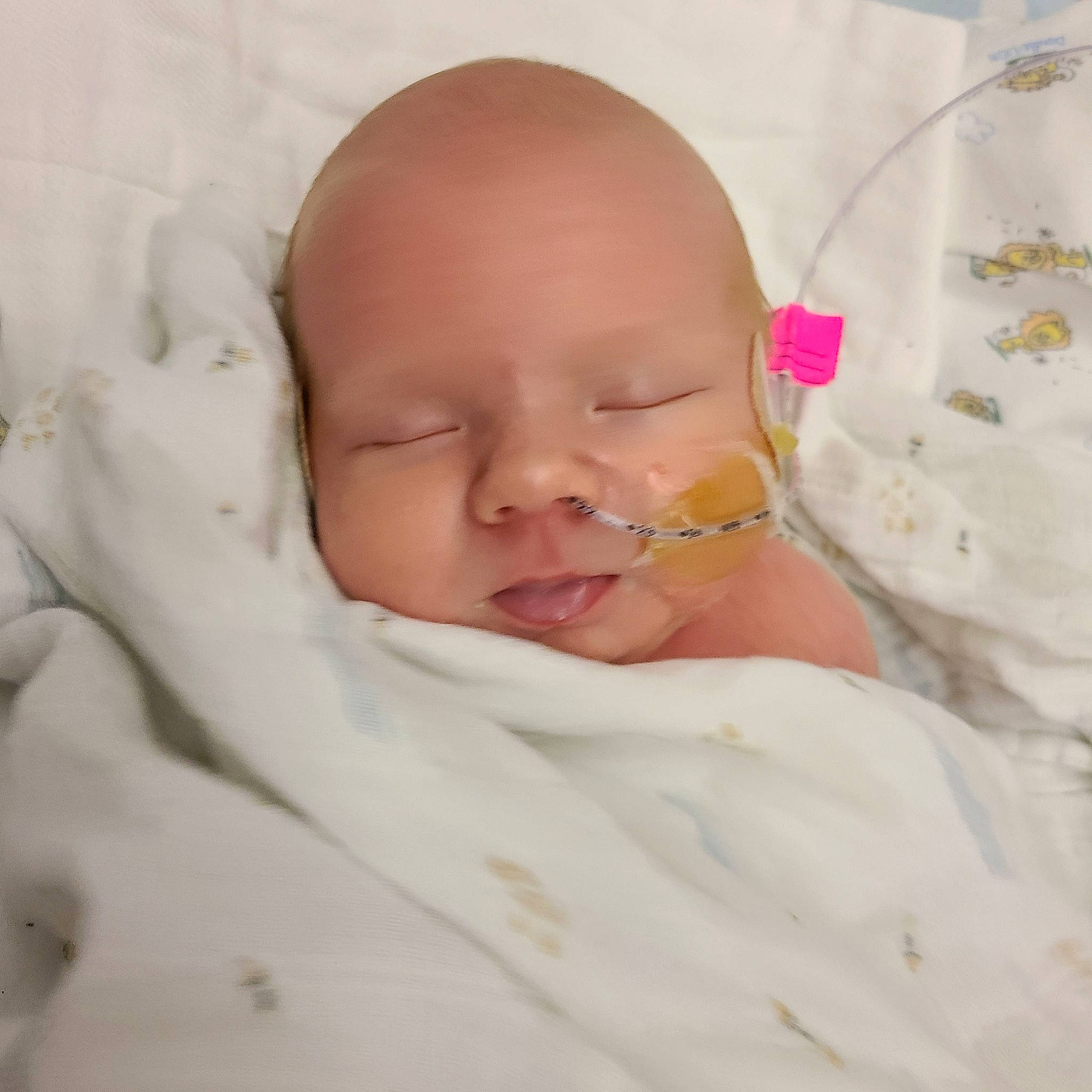 Graisyn is registered to the contest to win money with this photo: baby, baby_products, baby_toddler_clothing, bedding, bedtime, cheek, comfort, dress, ear, eye, eyebrow, head, headgear, iris, linens, lip, neck, nose, person, smile