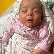 Sarah is registered to the contest to win money with this photo: newborn, baby, infant, sleeping, portrait, face, hospital, blanket, swaddle, pink_clothing, striped_blanket, bedding, indoor, close_up, calm, resting, head, hands, sunlight, photography