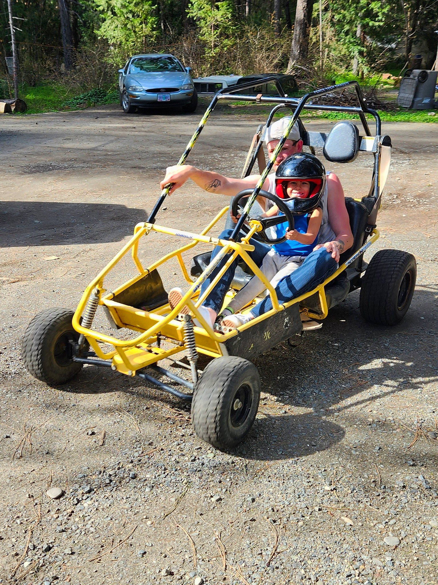 Brayden joined the competition — help win amazing prizes! alloy_wheel, asphalt, automotive_design, automotive_exterior, automotive_tire, bumper, car, grass, headwear, joy, locking_hubs, motor_vehicle, motorsport, person, plant, rim, road_surface, rolling, tire, tread