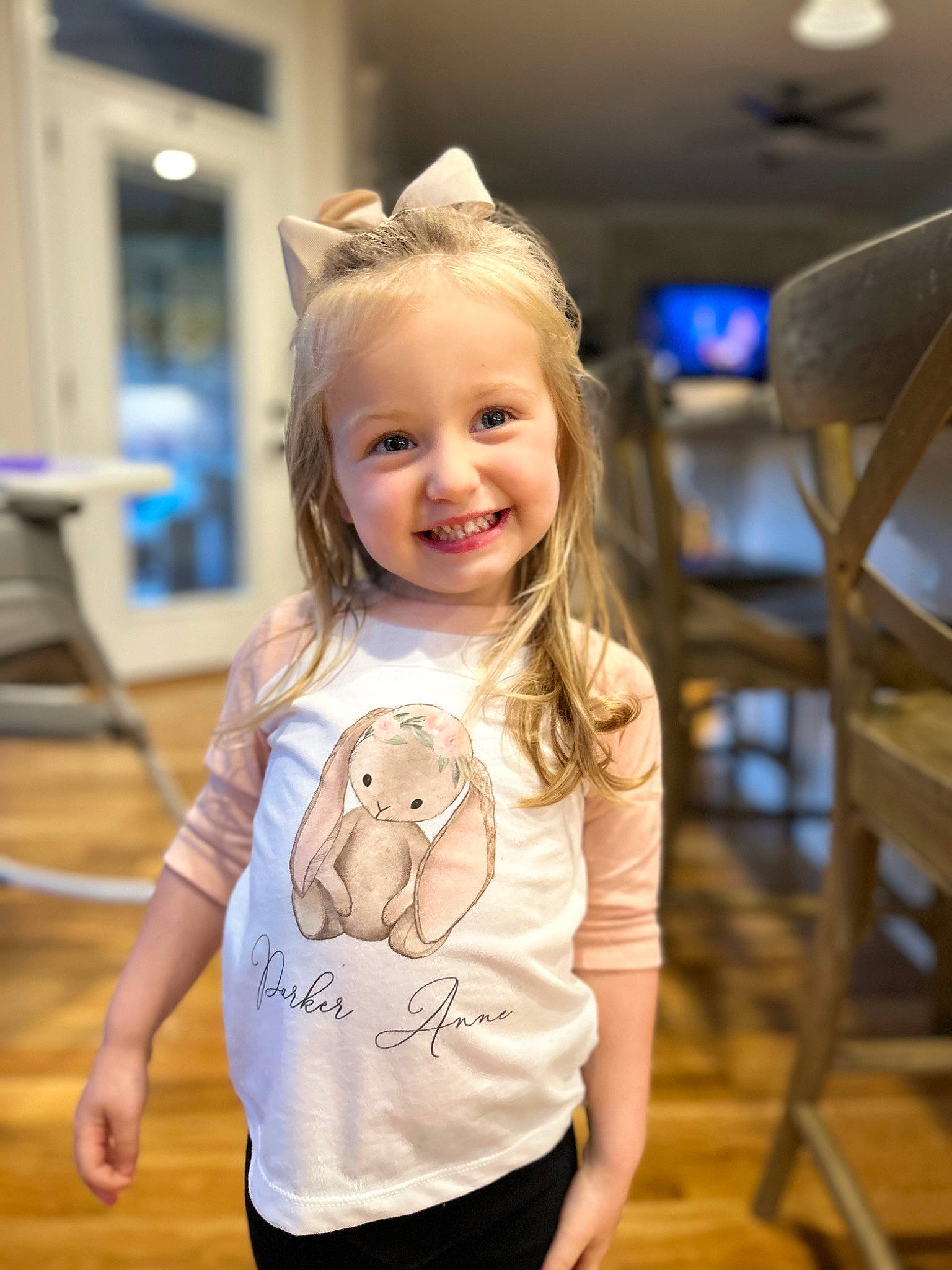 Parker is registered to the contest to win money with this photo: blond, chair, child, electric_blue, event, floor, flooring, fun, happy, joy, leisure, person, sitting, skin, sleeve, smile, standing, t_shirt, toddler, trunk