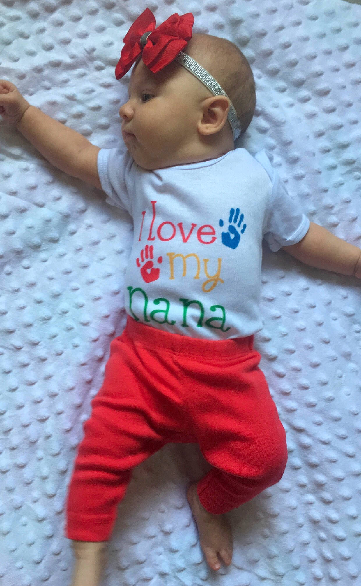 Chevelle is registered to the contest to win money with this photo: arm, baby, baby_toddler_clothing, baseball_cap, cap, child, face, fashion_accessory, happy, hat, headwear, joint, magenta, pajamas, pattern, person, pink, play, sleeve, sportswear