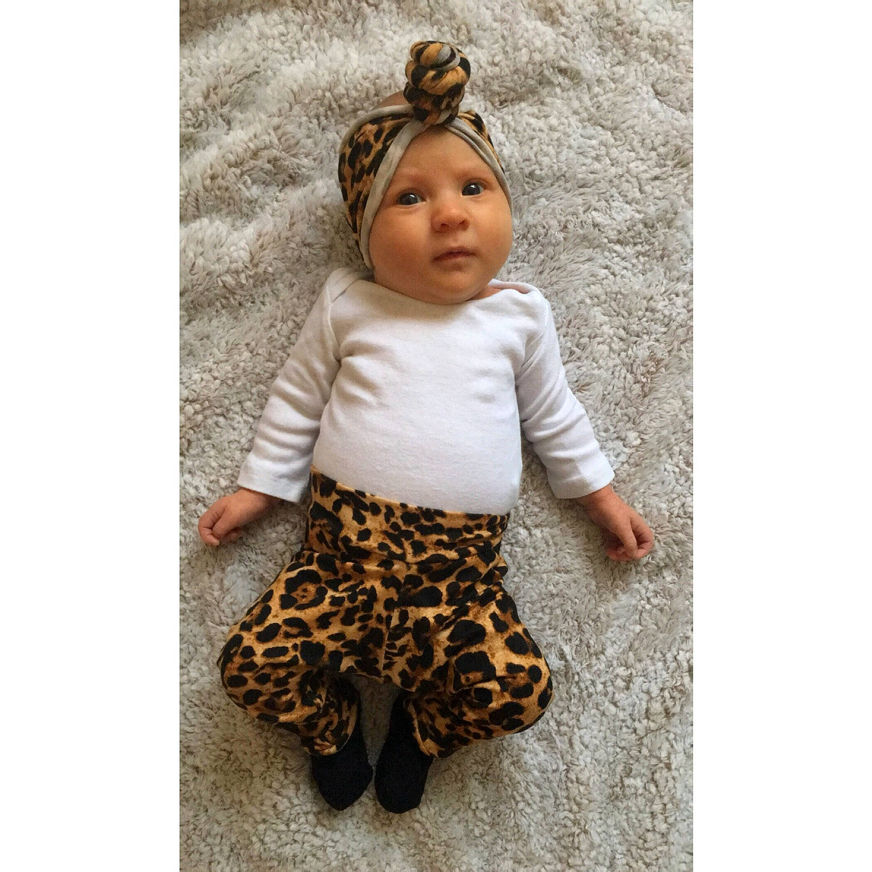 Chevelle is registered to the contest to win money with this photo: baby, baby_toddler_clothing, doll, fashion_design, fawn, head, headgear, headwear, human_body, jewellery, metal, pattern, person, plant, sleeve, stuffed_toy, t_shirt, toy, tree, waist