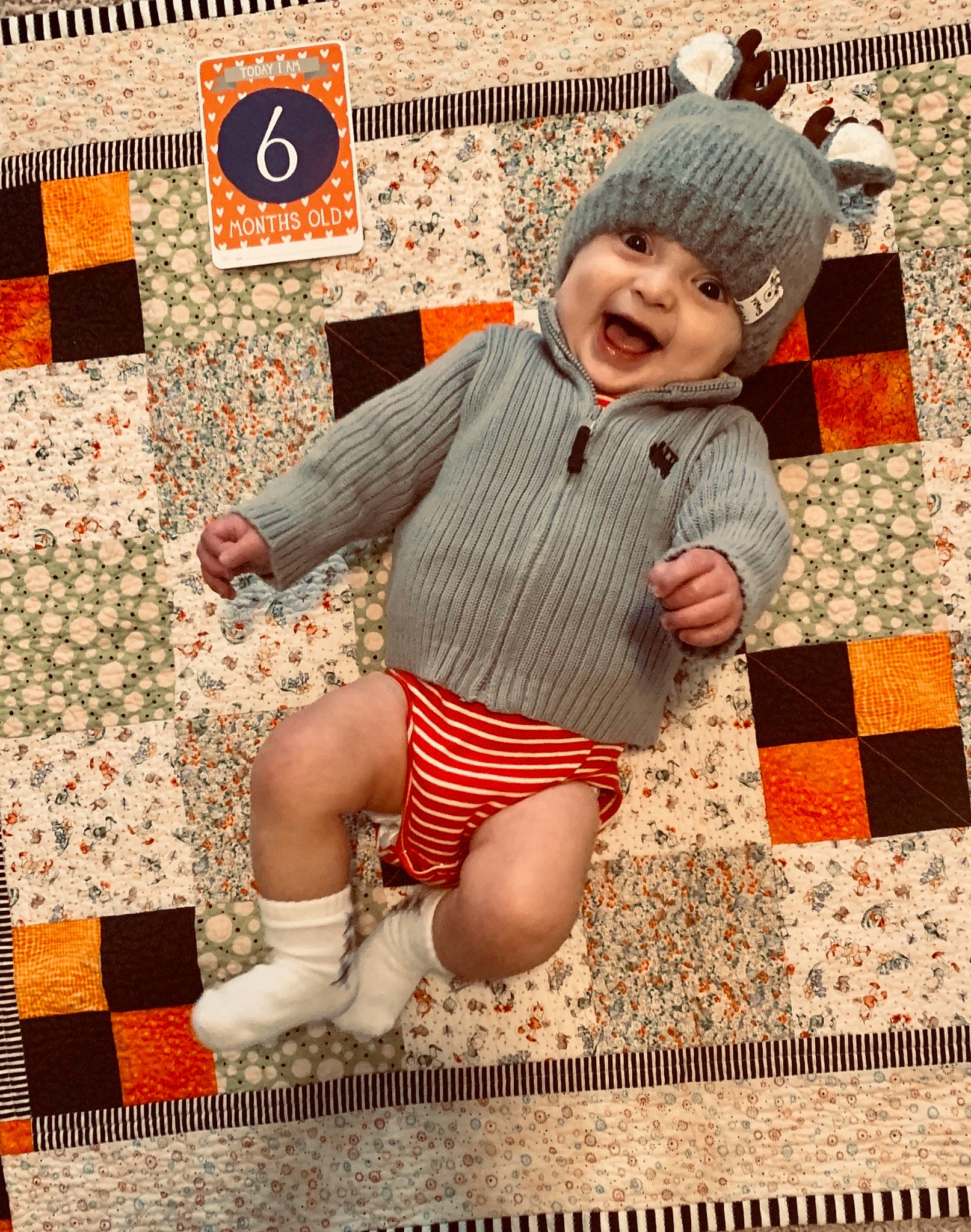Cruze joined the competition — help win amazing prizes! art, baby, child, craft, creative_arts, crochet, headgear, headwear, knit_cap, knitting, linens, orange, patchwork, pattern, person, play, quilt, textile, toddler, wool