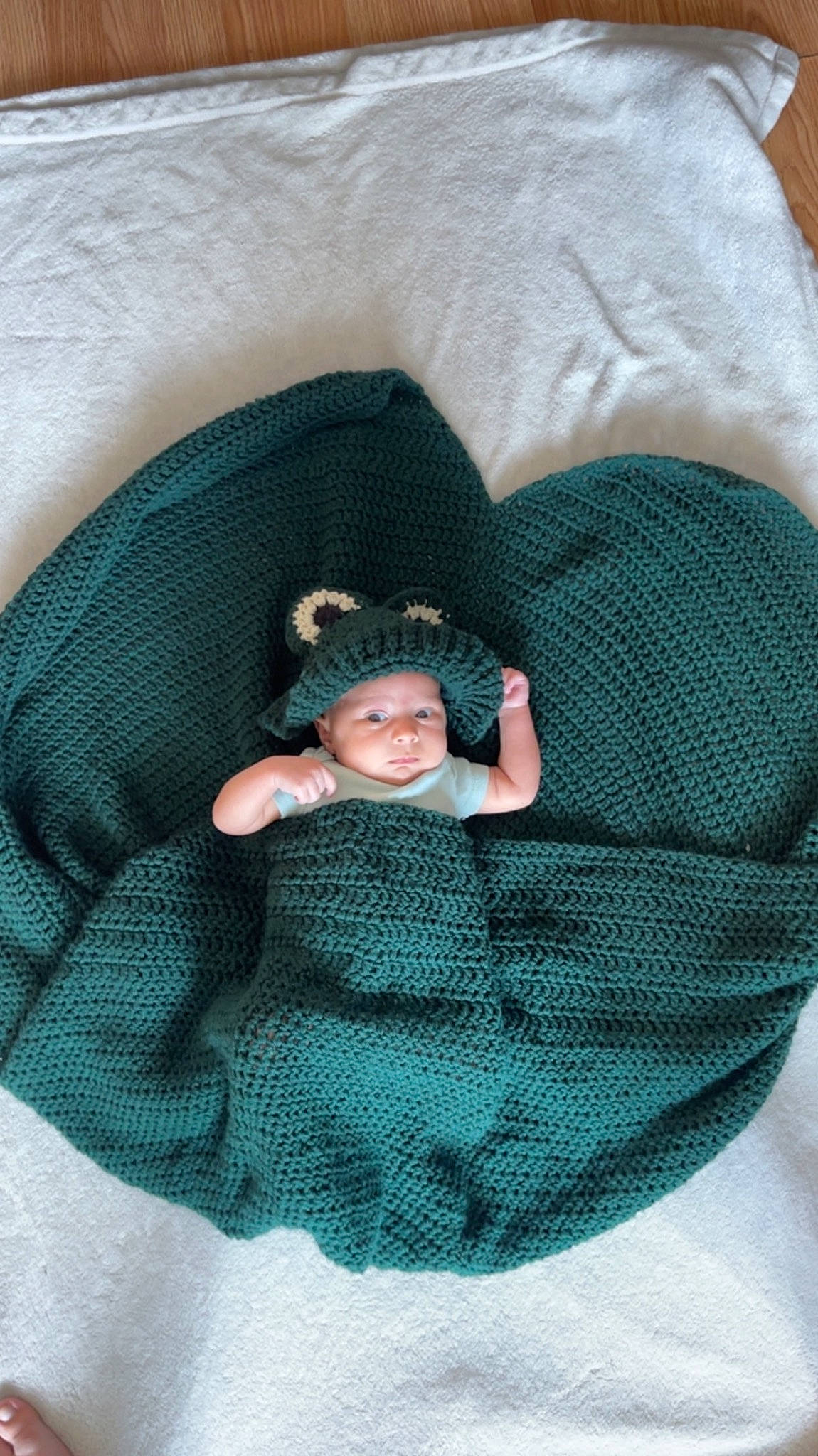 Mateo is registered to the contest to win money with this photo: baby, baby_products, baby_sleeping, baby_toddler_clothing, comfort, electric_blue, fashion_accessory, grey, headwear, linens, nap, pattern, person, product, room, sitting, sleep, sleeve, textile, toddler