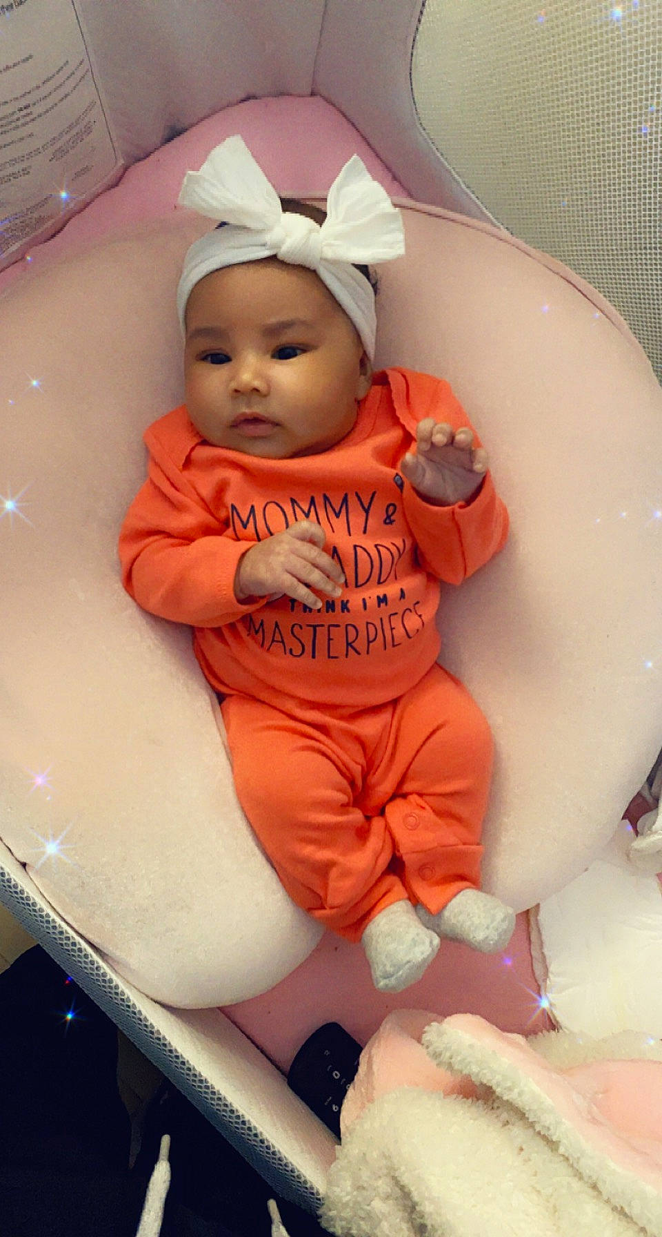 Mylah is registered to the contest to win money with this photo: baby, baby_products, baby_safety, baby_toddler_clothing, cake, carmine, chair, child, dessert, glove, headwear, peach, person, personal_protective_equipment, pink, product, sitting, sleeve, sugar_cake, t_shirt