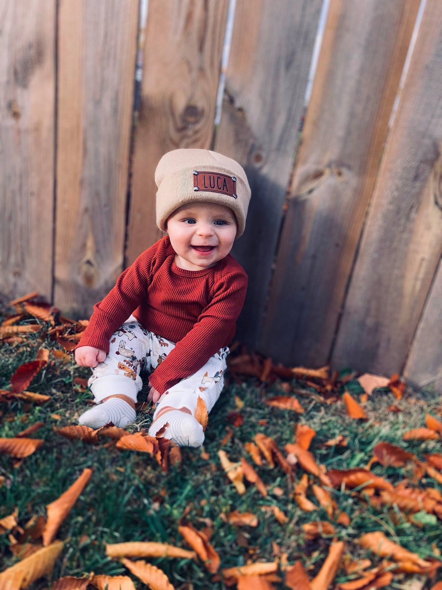 Luca is registered to the contest to win money with this photo: baby, baby_toddler_clothing, carmine, child, deciduous, eye, flooring, grass, happy, hat, headwear, human_leg, joy, orange, people, people_in_nature, person, plant, smile, toddler