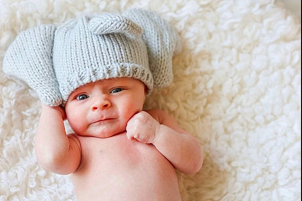 Luca is registered to the contest to win money with this photo: baby, baby_sleeping, baby_toddler_clothing, beauty, cap, child, close_up, comfort, fashion_accessory, finger, hair_accessory, headgear, headwear, knit_cap, linens, person, skin, smile, thumb, toddler