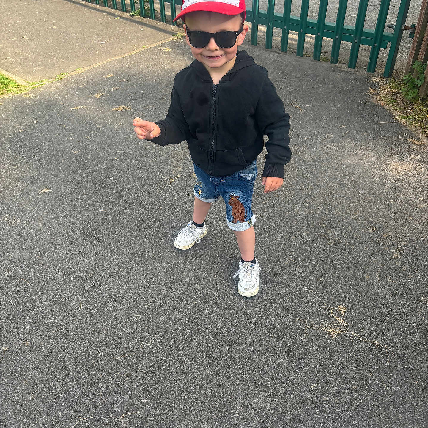 Freddie-Lee is registered to the contest to win money with this photo: accessories, baseballcap, boy, cap, child, city, clothing, face, footwear, hat, head, male, pants, person, photography, portrait, shoe, shorts, sunglasses, walking