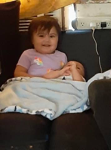 Hayleigh is registered to the contest to win money with this photo: baby, baby_toddler_clothing, bedding, bedroom, cheek, chest_of_drawers, child, comfort, finger, home_accessories, human, human_body, joy, lamp, lap, linens, person, pillow, product, room