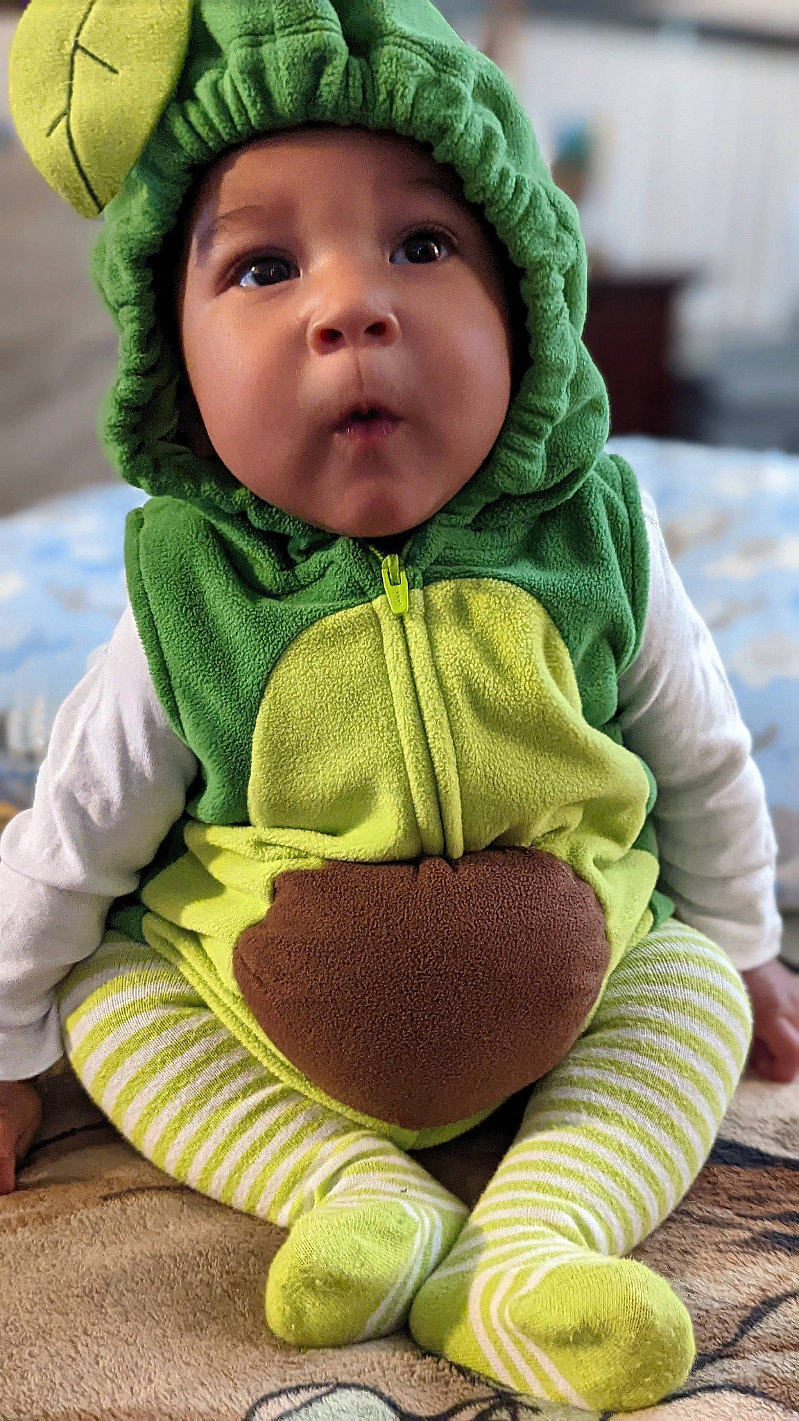 Jurnee joined the competition — help win amazing prizes! baby, baby_products, baby_toddler_clothing, cap, cheek, child, comfort, face, grass, green, headgear, headwear, knit_cap, outerwear, person, skin, sleeve, surprise, toddler, white