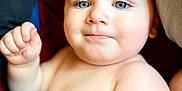 Cash joined the competition — help win amazing prizes! baby, child, blue_eyes, bare_chest, curly_hair, cute, infant, portrait, skin, smile, closeup, toddler, comfort, blanket, indoors, expression, face, human, young, lying_down