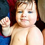 baby, child, blue_eyes, bare_chest, curly_hair, cute, infant, portrait, skin, smile, closeup, toddler, comfort, blanket, indoors, expression, face, human, young, lying_down