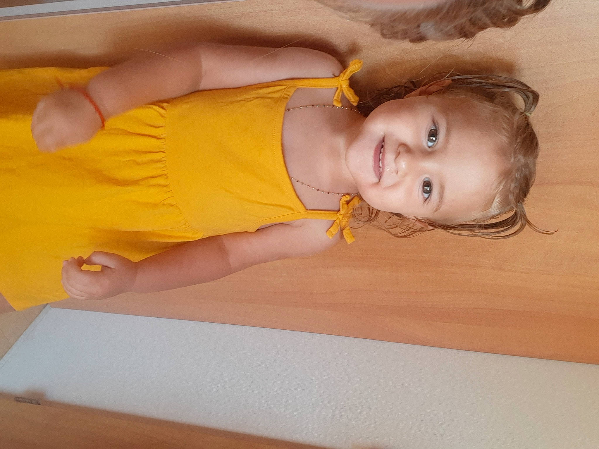 Whitney participe au concours pour gagner de l'argent avec cette photo : abdomen, bathing, blond, chest, child, elbow, eyelash, fun, hair, happy, human_leg, joy, leisure, long_hair, person, room, smile, thigh, trunk, wood