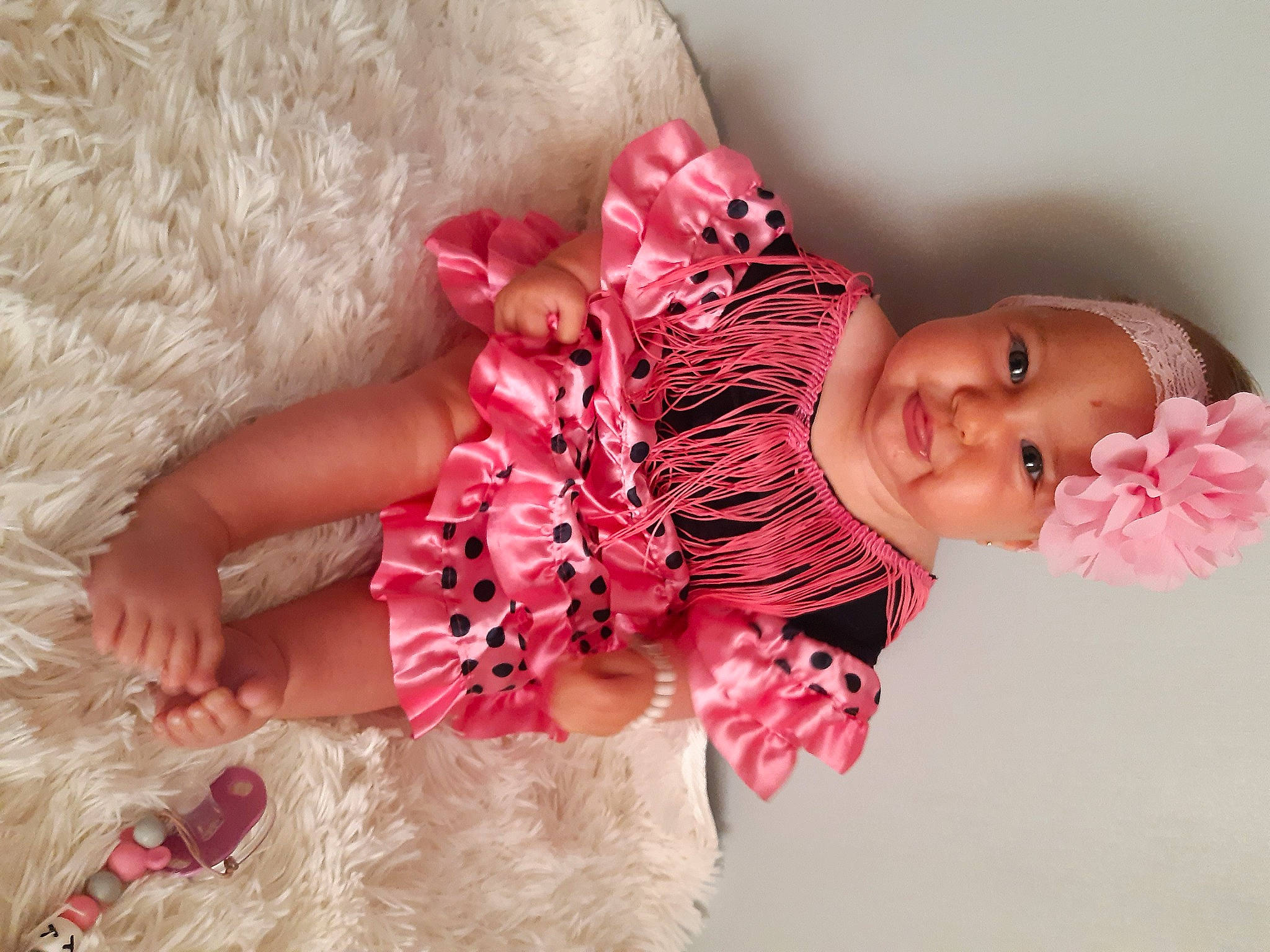 Whitney a rejoint le concours — aidez-le/la à gagner de superbes lots ! arm, baby, baby_toddler_clothing, dress, embellishment, face, fashion_design, hair_accessory, hand, happy, headgear, headwear, magenta, pattern, peach, person, pink, skin, sleeve, smile