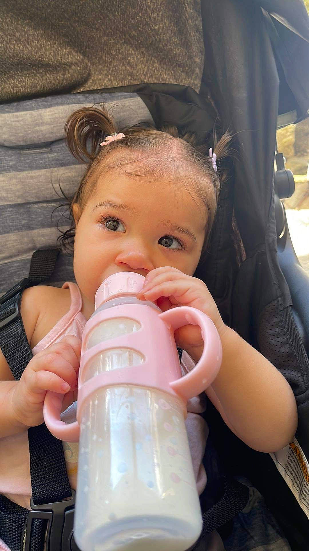 Felicity is registered to the contest to win money with this photo: baby, baby_bottle, baby_products, baby_toddler_clothing, beauty, cheek, child, drinkware, ear, eyebrow, eyelash, facial_expression, hairstyle, hand, nail, nose, person, plastic_bottle, product, skin