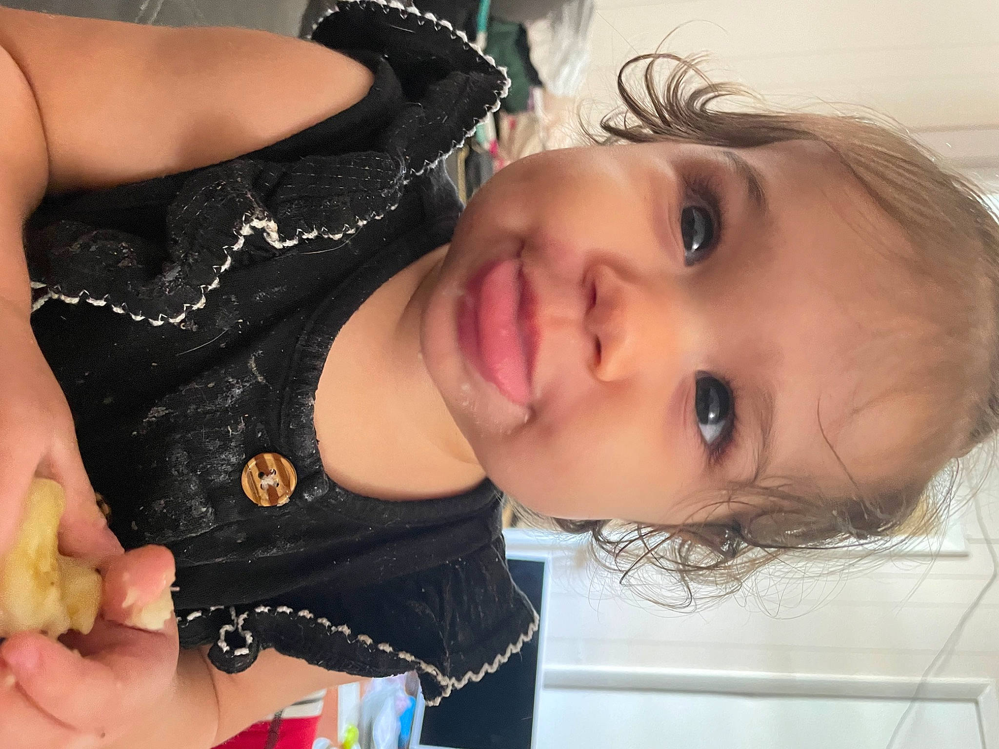 Felicity is registered to the contest to win money with this photo: black_hair, chest, child, cool, eyebrow, eyelash, finger, food, gesture, happy, lip, long_hair, mouth, nail, neck, nose, person, skin, smile, toddler