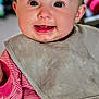 baby, infant, smile, tongue, bib, clothing, pink_stripes, face, child, cute, portrait, indoors, happy, cheeks, eyes, head, person, baby_clothes, closeup, skin