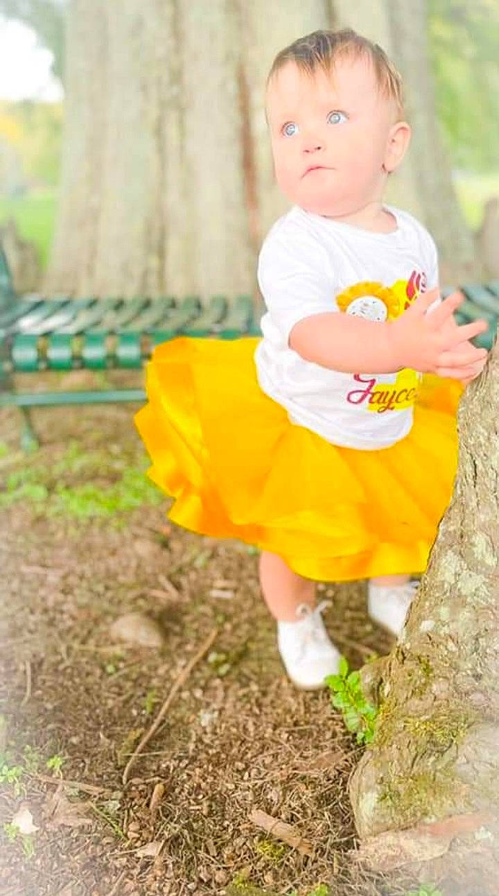 Jaycelynn is registered to the contest to win money with this photo: baby, baby_toddler_clothing, child, eye, face, fun, grass, happy, head, leaf, leisure, orange, people_in_nature, person, plant, recreation, smile, summer, t_shirt, toddler