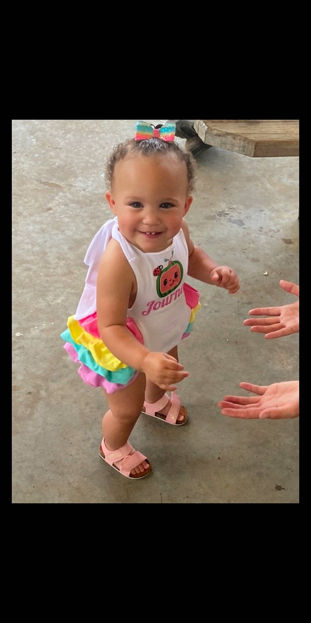 Journey is registered to the contest to win money with this photo: baby, baby_toddler_clothing, child, foot, fun, grass, hairstyle, happy, human_leg, joy, leisure, person, pink, play, recreation, sandal, shorts, sitting, smile, standing