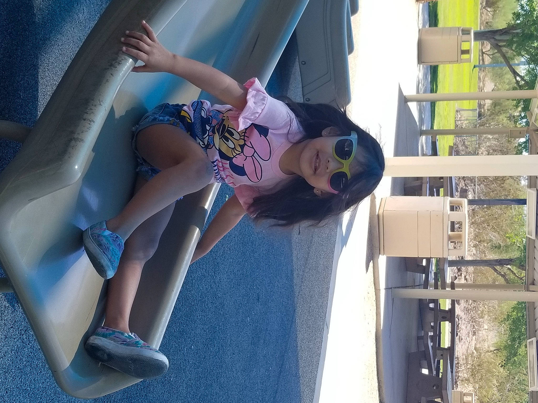 'Iolana is registered to the contest to win money with this photo: calf, car, city, elbow, electric_blue, eyewear, foot, fun, human_leg, knee, leisure, person, plant, recreation, sandal, shorts, sitting, thigh, tree, vacation