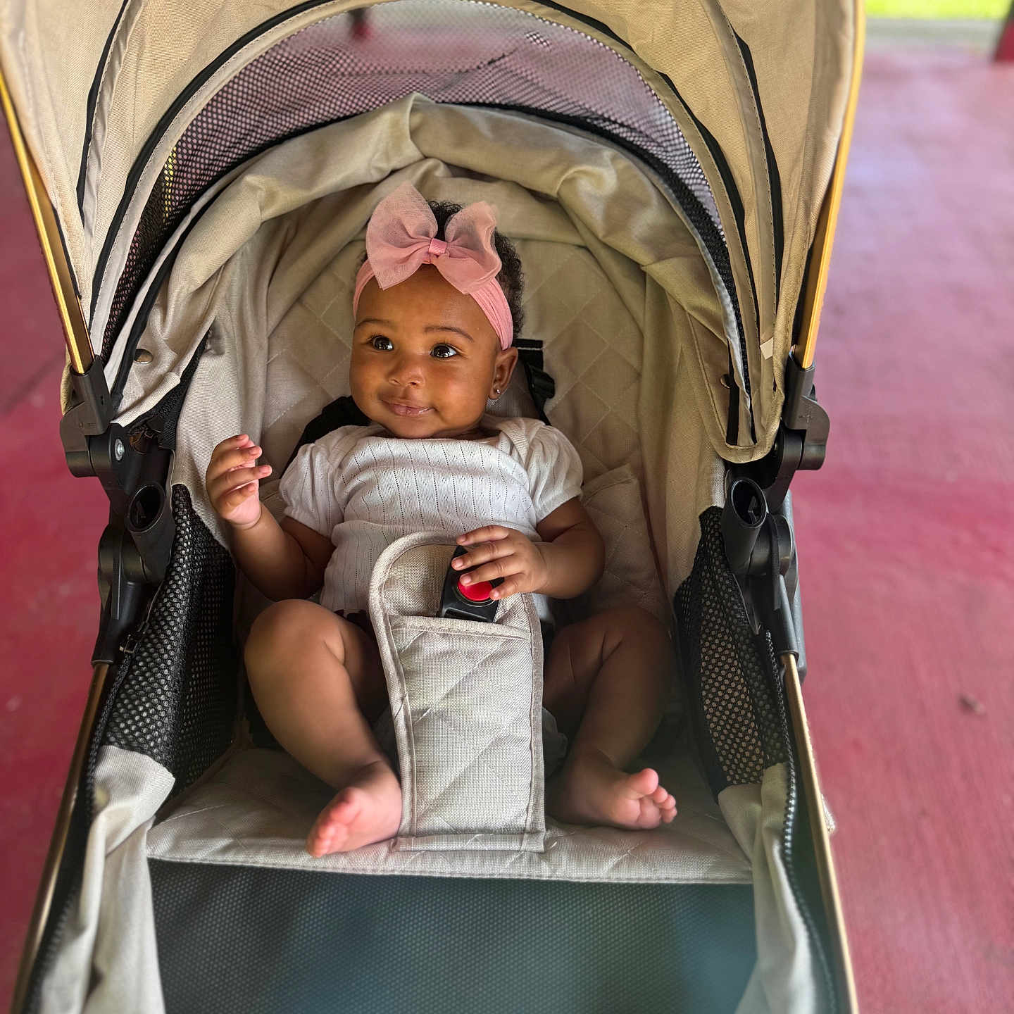 Lavendar joined the competition — help win amazing prizes! baby, baby_girl, child, clothing, cute, fabric, face, footwearless, happy, headband, infant, mesh_pocket, outdoor, pink_bow, portrait, seatbelt, sitting, smiling, stroller, sunlight