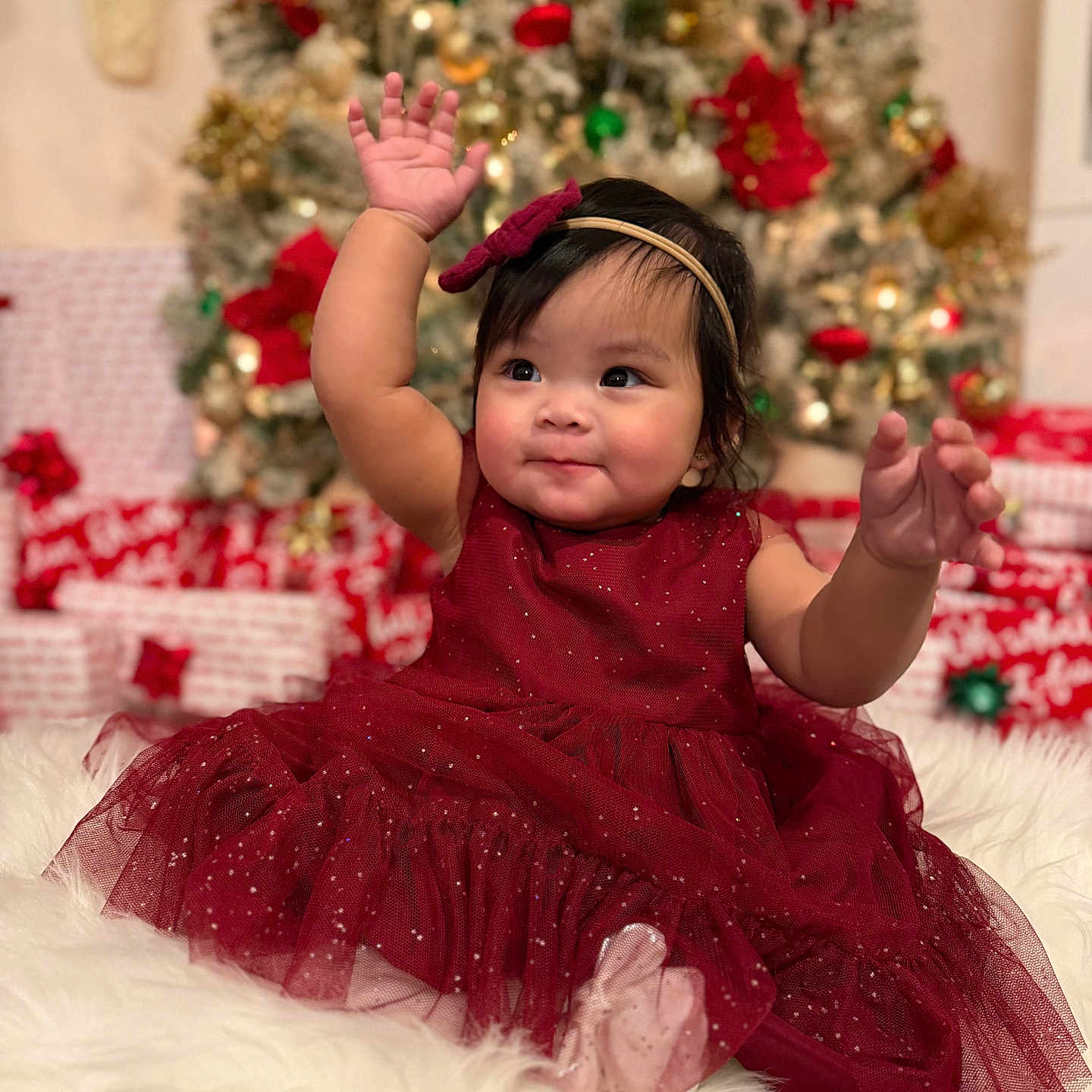 Scarlett joined the competition — help win amazing prizes! baby, celebration, child, christmas_tree, cute, dress, festive, fluffy_surface, girl, happy, headband, holiday, holiday_decor, indoors, portrait, presents, raising_hands, red_dress, smile, sparkle