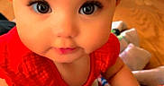 Enyarayne joined the competition — help win amazing prizes! baby, child, infant, red_clothing, blanket, indoor, floor, wood_floor, curious, closeup, face, big_eyes, cute, toddler, crawling, colorful_blanket, soft_lighting, portrait, person, home