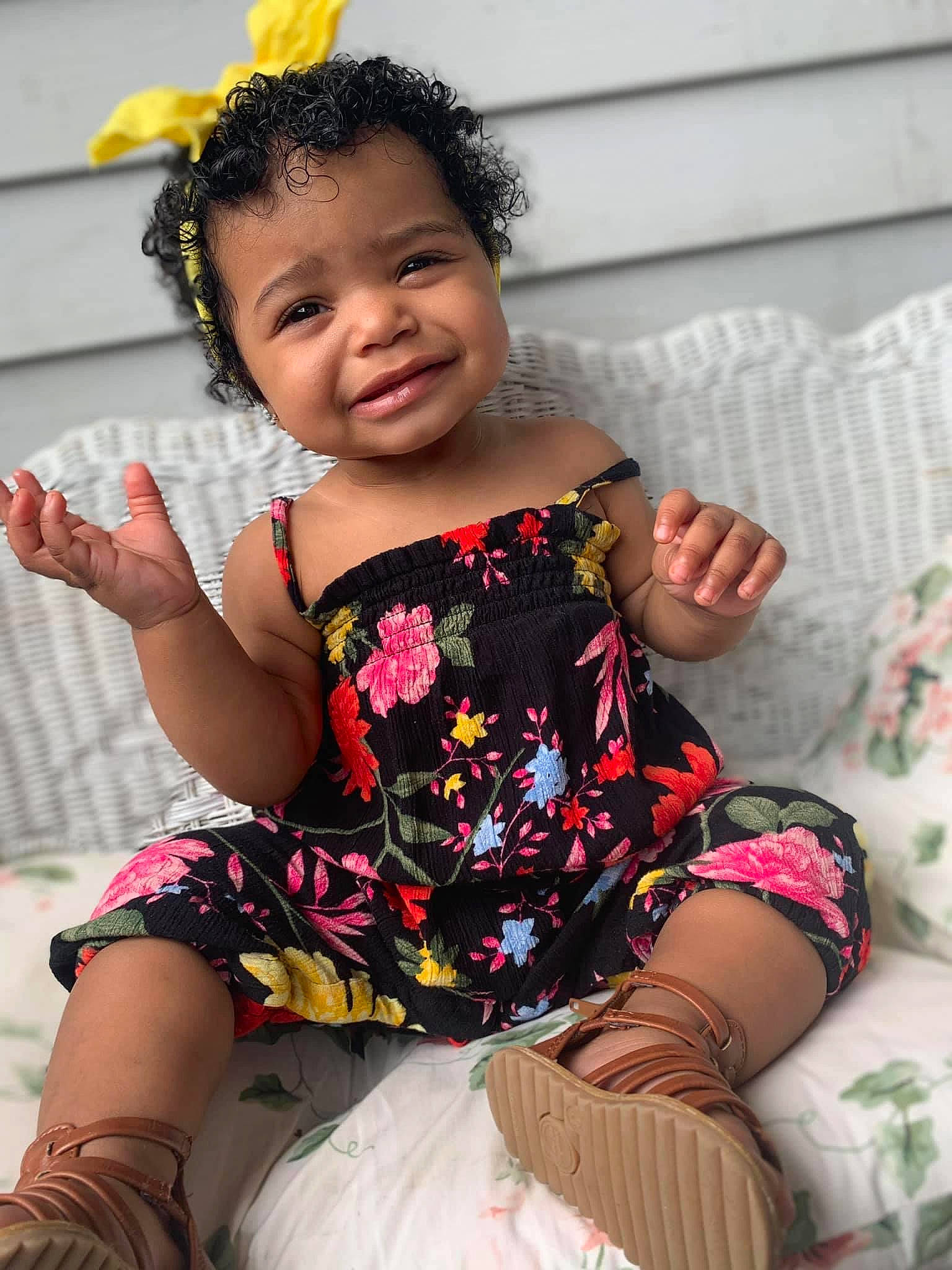 Avaya is registered to the contest to win money with this photo: arm, baby_toddler_clothing, child, child_model, costume, fashion_accessory, flower, hair_accessory, happy, joy, leg, person, sitting, skin, smile, toddler, yellow